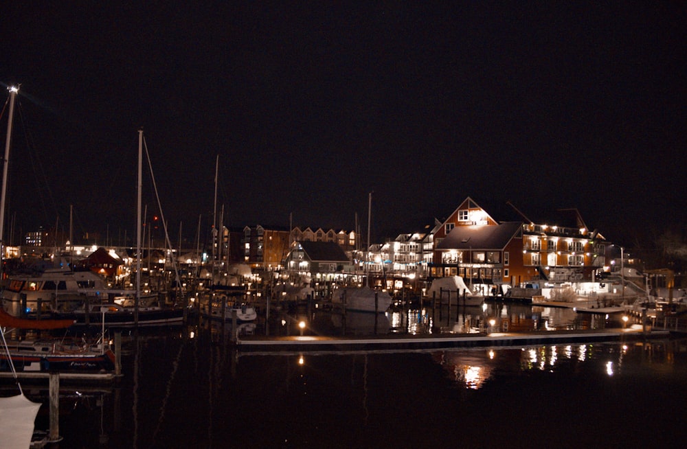 a harbor filled with lots of boats at night