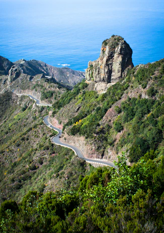 a winding road on the side of a mountain