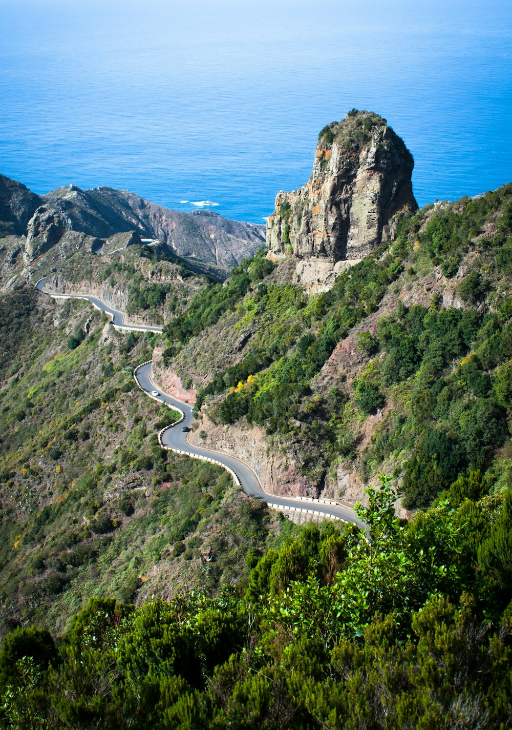 a winding road on the side of a mountain