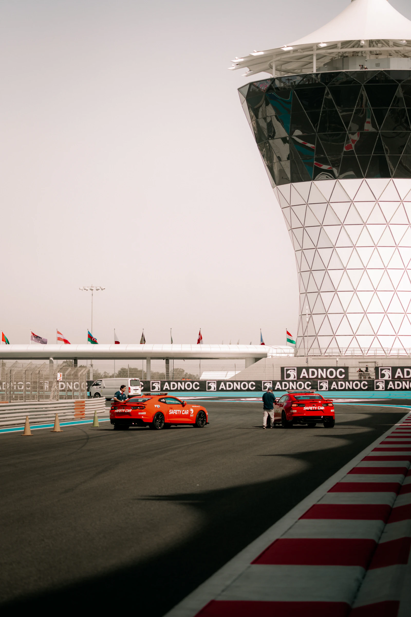 Cars on the Yas Marina Circuit straight below the circuit's tower