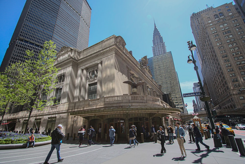 a group of people standing in front of a building