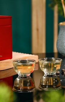 A serene setting with traditional hijama cups arranged neatly on a wooden tray, soft natural light highlighting their glass surfaces.