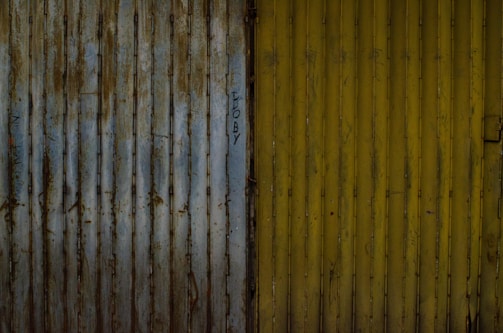 Photos comparing a worn-out lift gate and the same gate after welding and repainting.