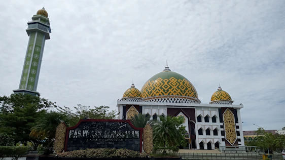 A clean, modern dashboard interface displaying masjid inventory and analytics with emerald green accents.