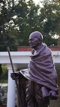 a statue of a man with a cane