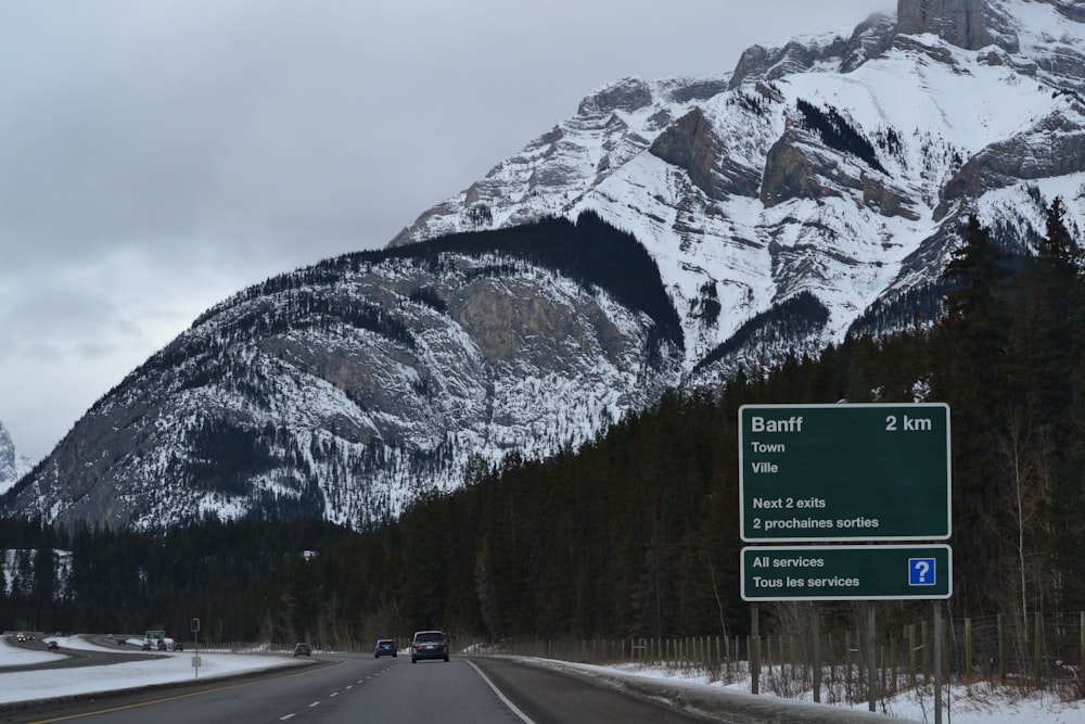 a highway with a mountain in the background