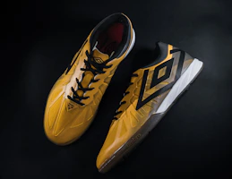 A pair of vibrant padel shoes designed for agility, displayed on a court
