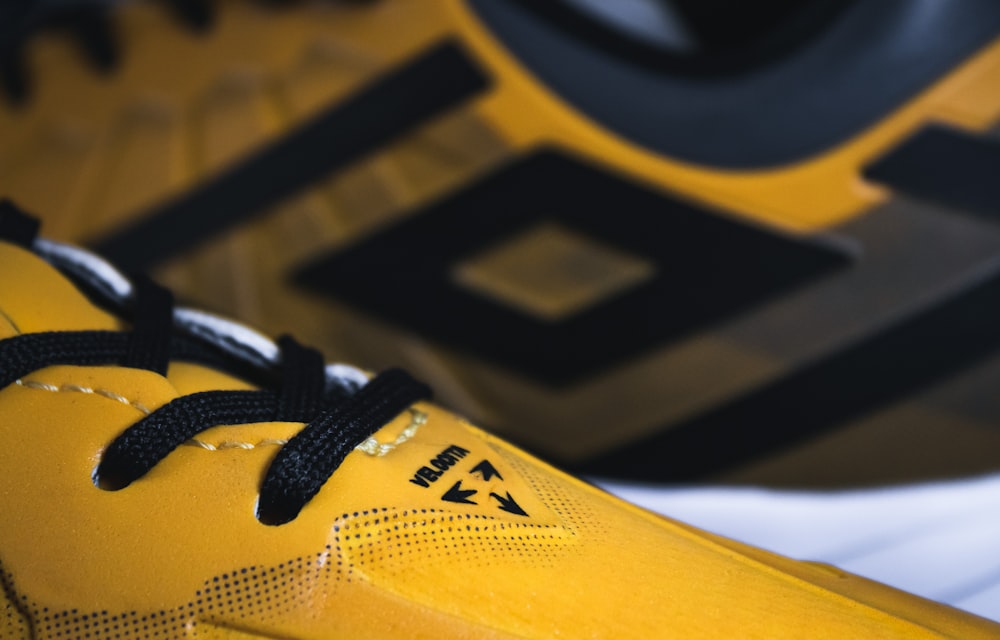 a close up of a pair of yellow shoes