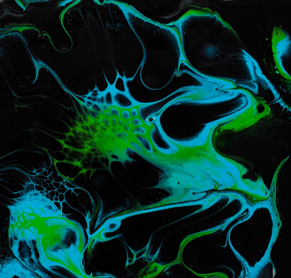 a black background with green and blue swirls
