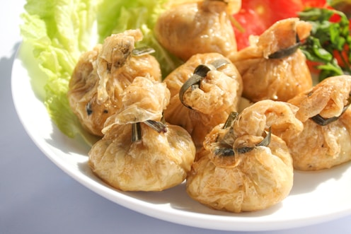 a white plate topped with meat and vegetables