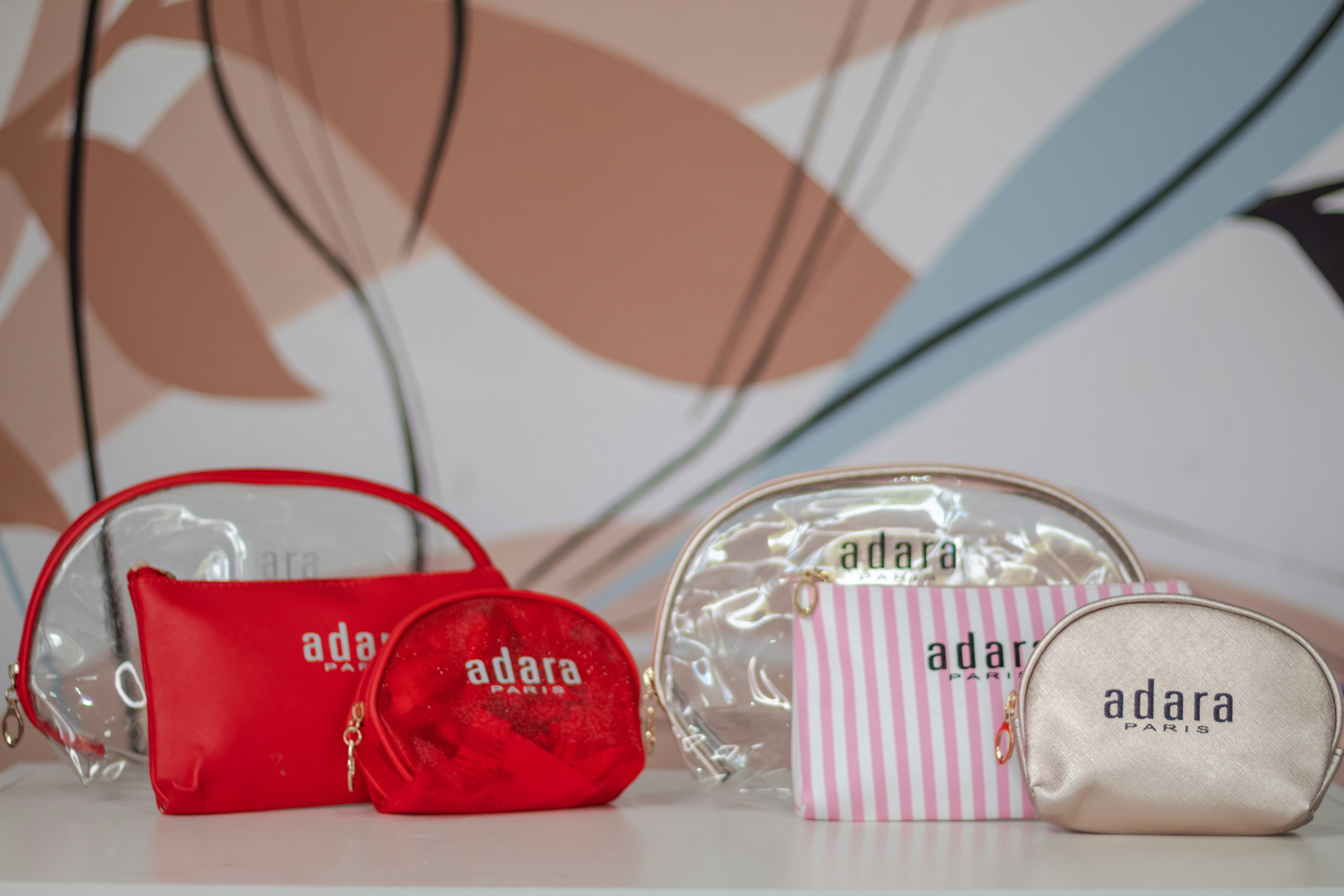 three different types of purses sitting on a table