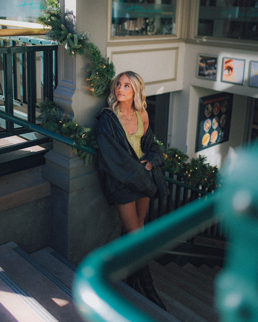 a woman sitting on the steps of a building