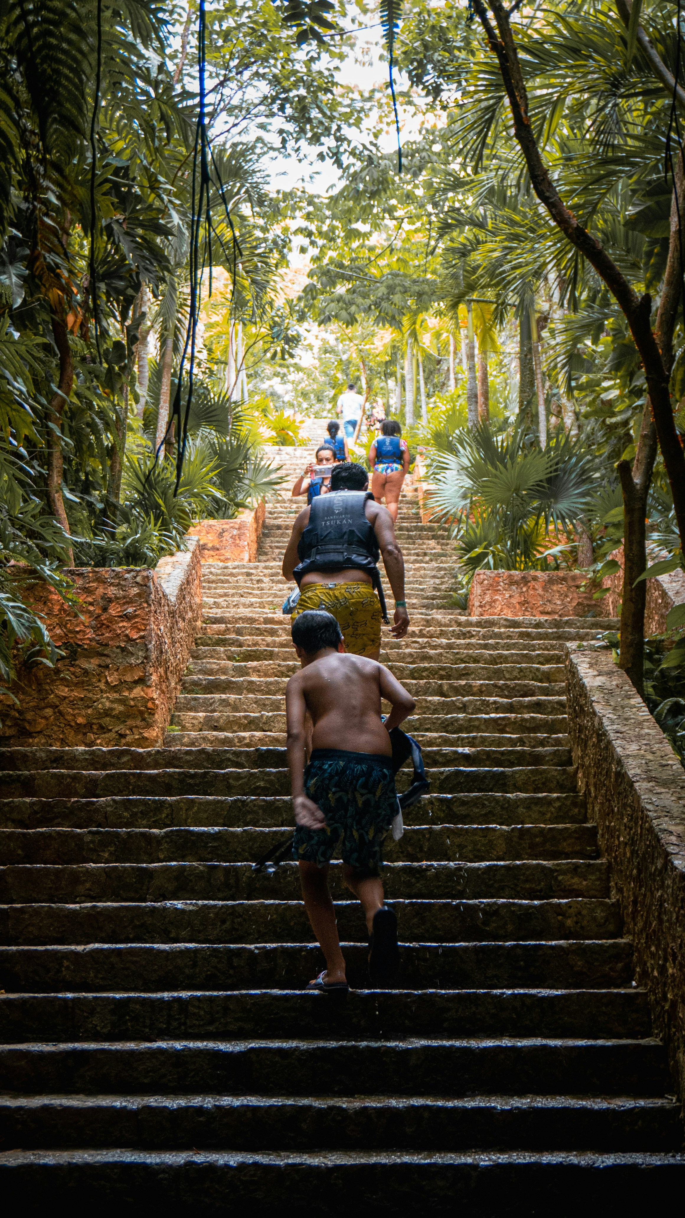 A group of people walking down a set of stairs photo – Free People ...