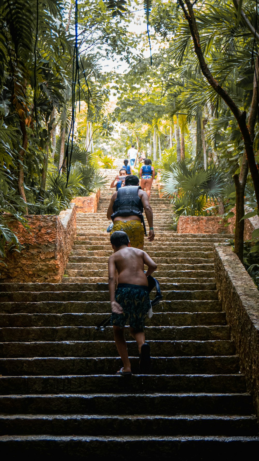 a group of people walking down a set of stairs