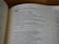 A close-up view of a book open to a page with text from 'The Books of the Prophets.' The passage is titled 'A prophecy against Moab,' with chapter and verse numbers marking the start and progression of the text. The text is printed in a serif font, and the page is well lit, indicating a reading environment.