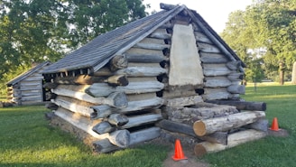 Cozy rental cabin with tools and work gear outside, ready for contractor guests.