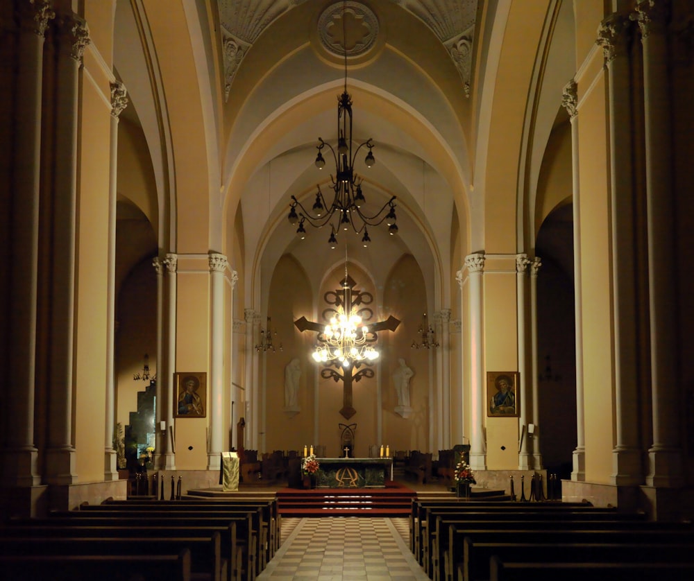 a church with a chandelier and a chandelier hanging from the ceiling