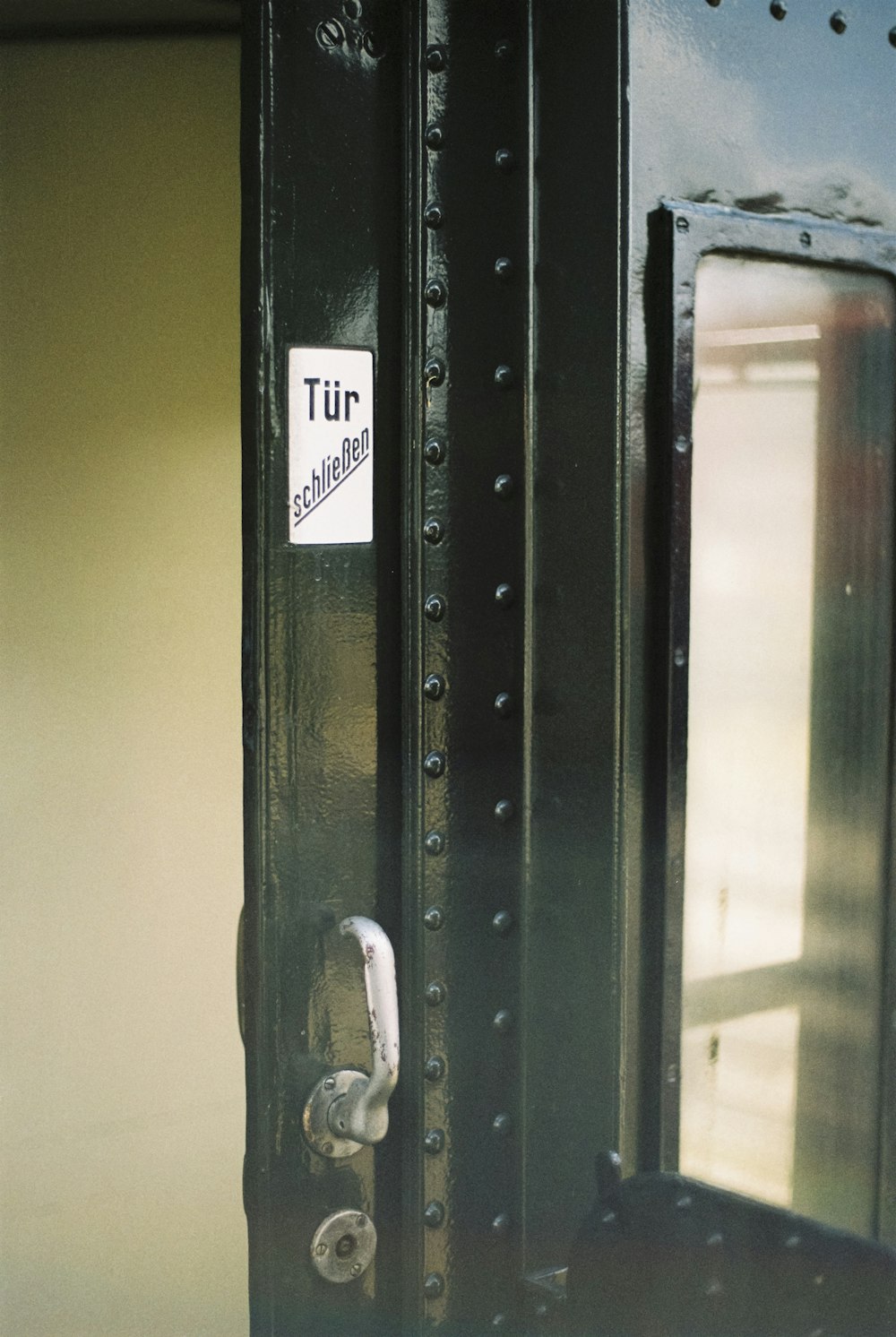 a close up of a door with a sign on it