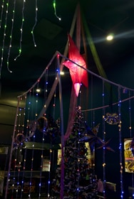 A festive event setup with Christmas decorations and lights.
