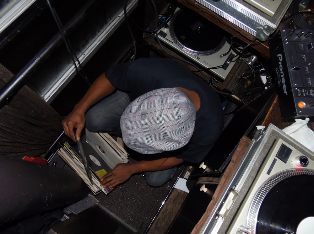 a man in a room with a record player