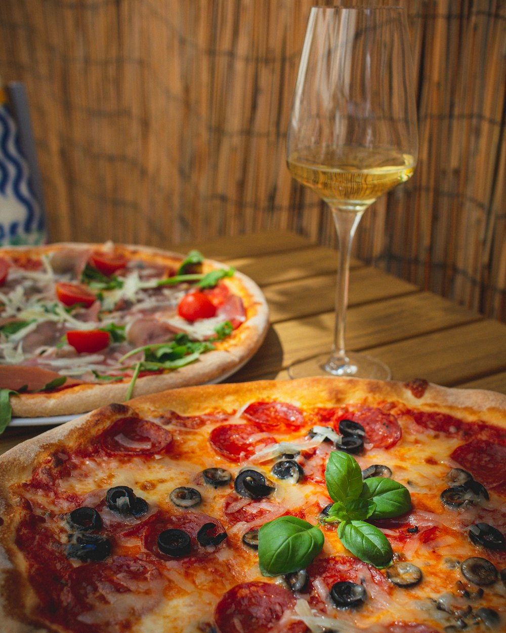 a couple of pizzas sitting on top of a table