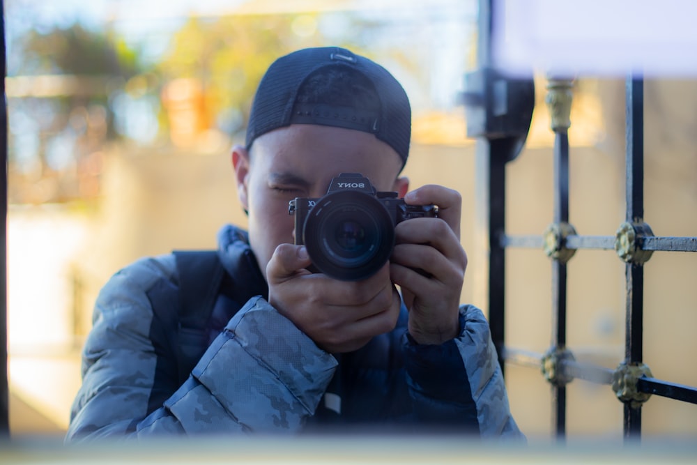 a man taking a picture of himself with a camera