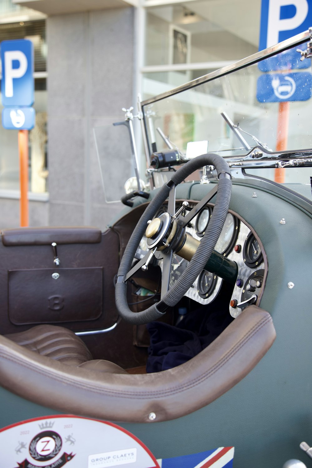 the interior of an old car with a steering wheel