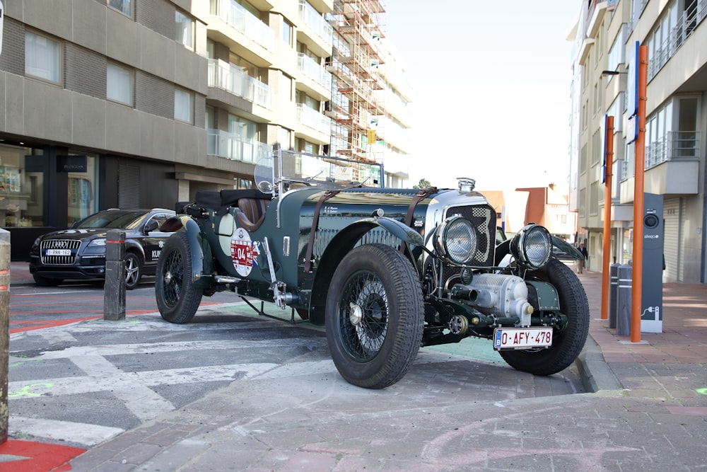 a vintage car parked on the side of the road