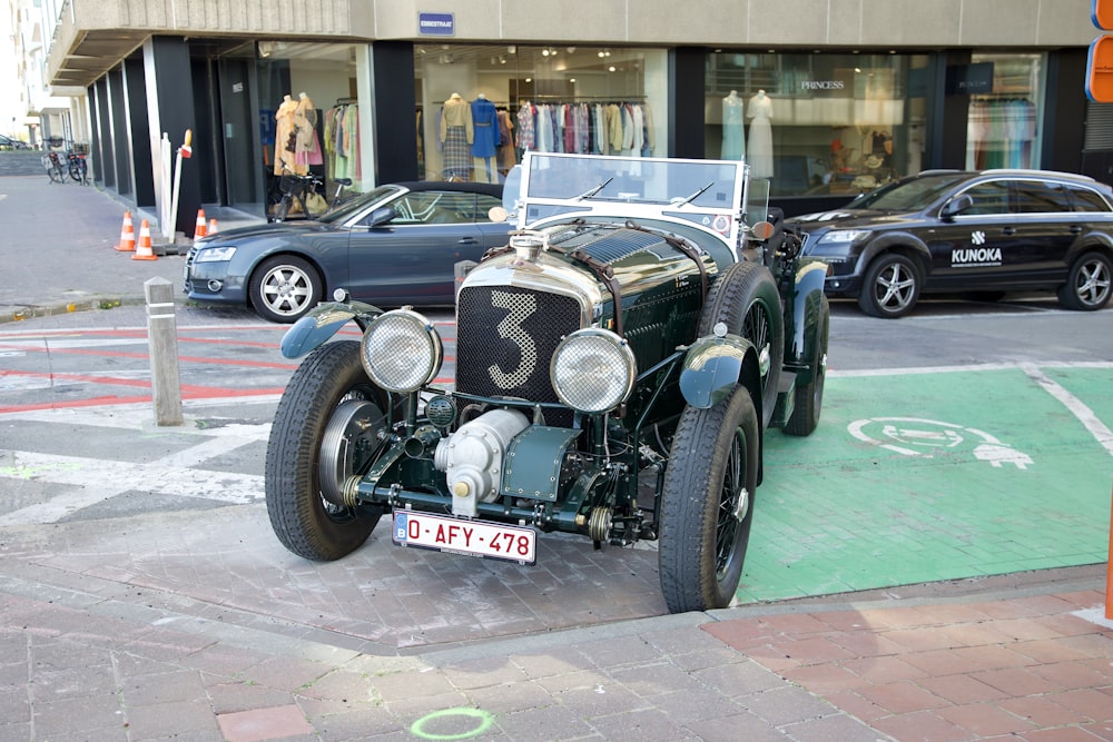 a vintage car parked on the side of the road