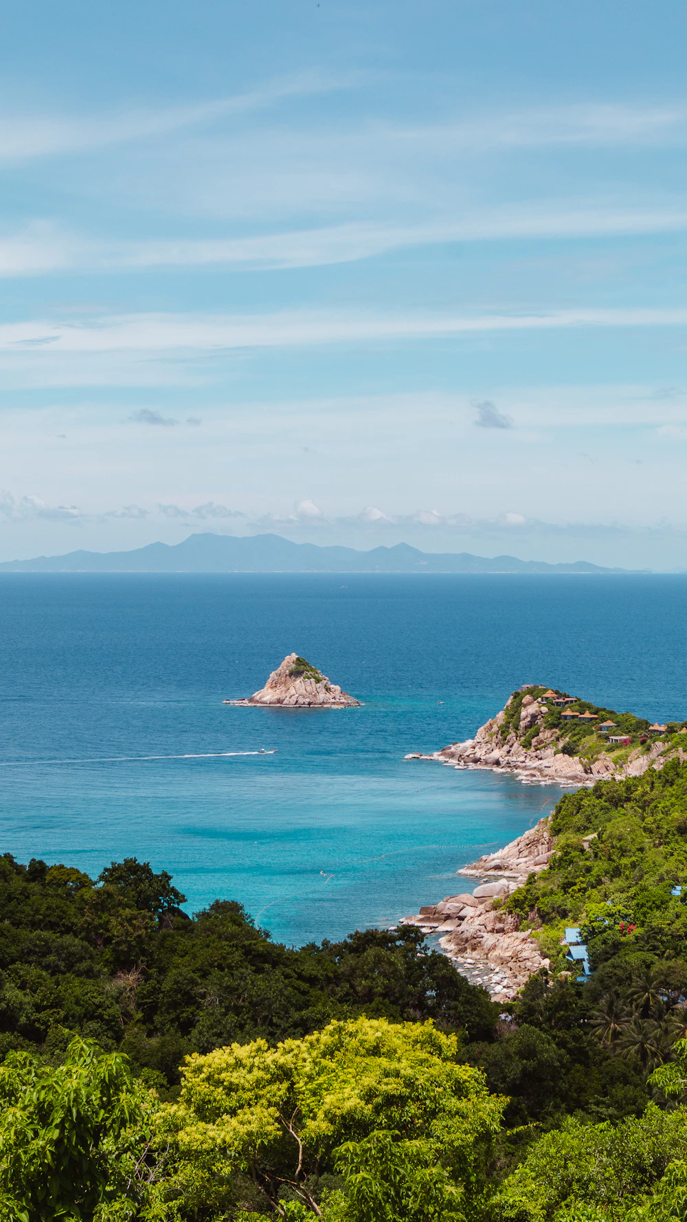 Calm water ringed by trees on Koh Phangan