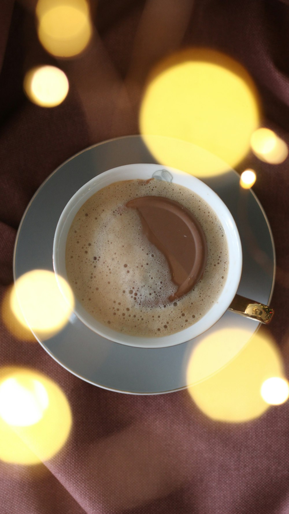 a cup of coffee with a spoon in it