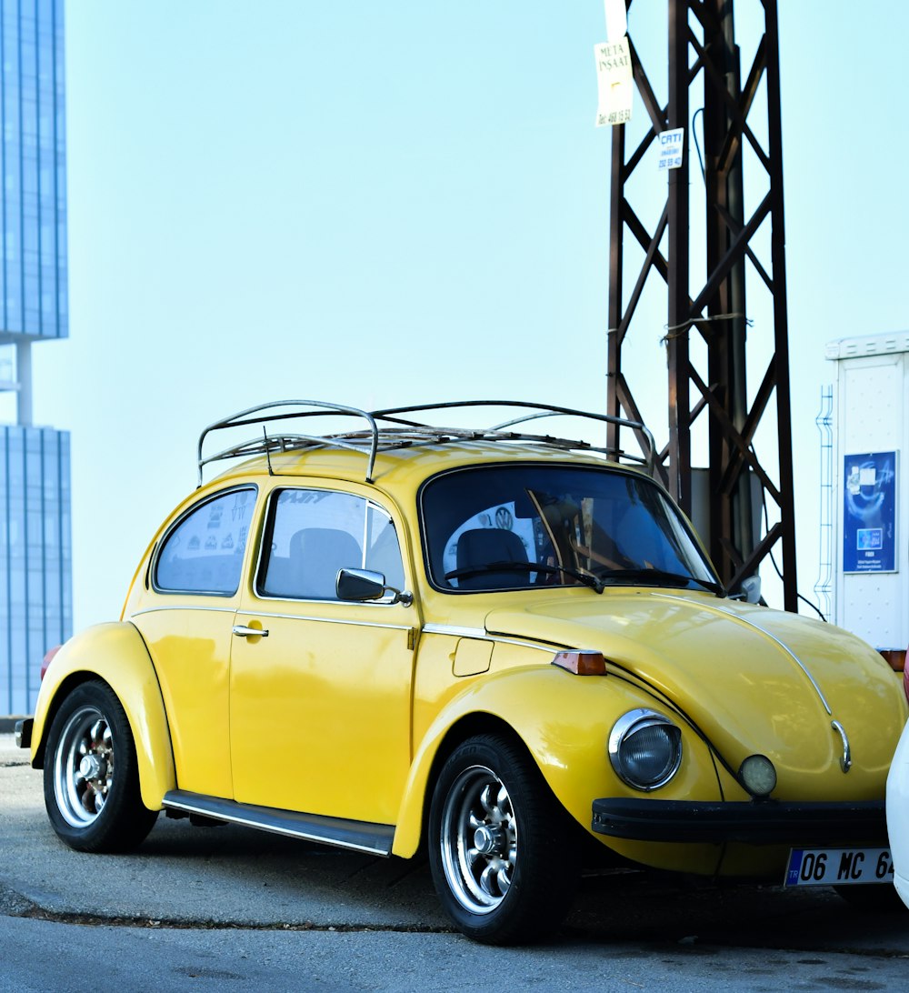 a yellow car parked in front of a tall building