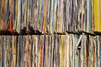 a large number of papers stacked on top of each other