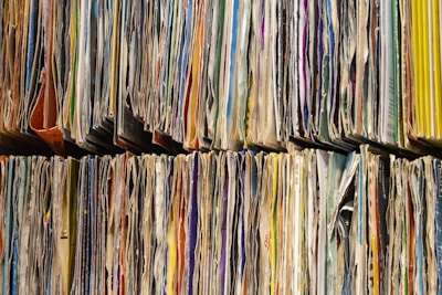 a large number of papers stacked on top of each other