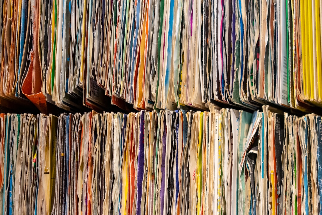 a large number of papers stacked on top of each other,
