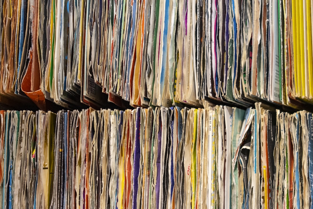 a large number of papers stacked on top of each other