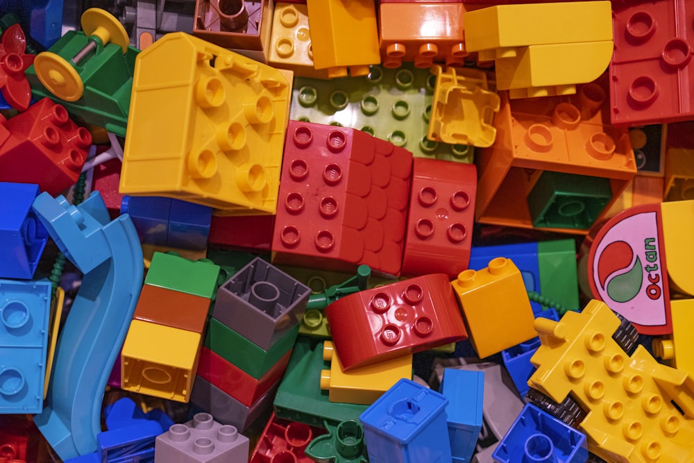 a pile of colorful legos sitting next to each other