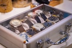 Various Seiko watch cases displayed in a row with different shapes and finishes.