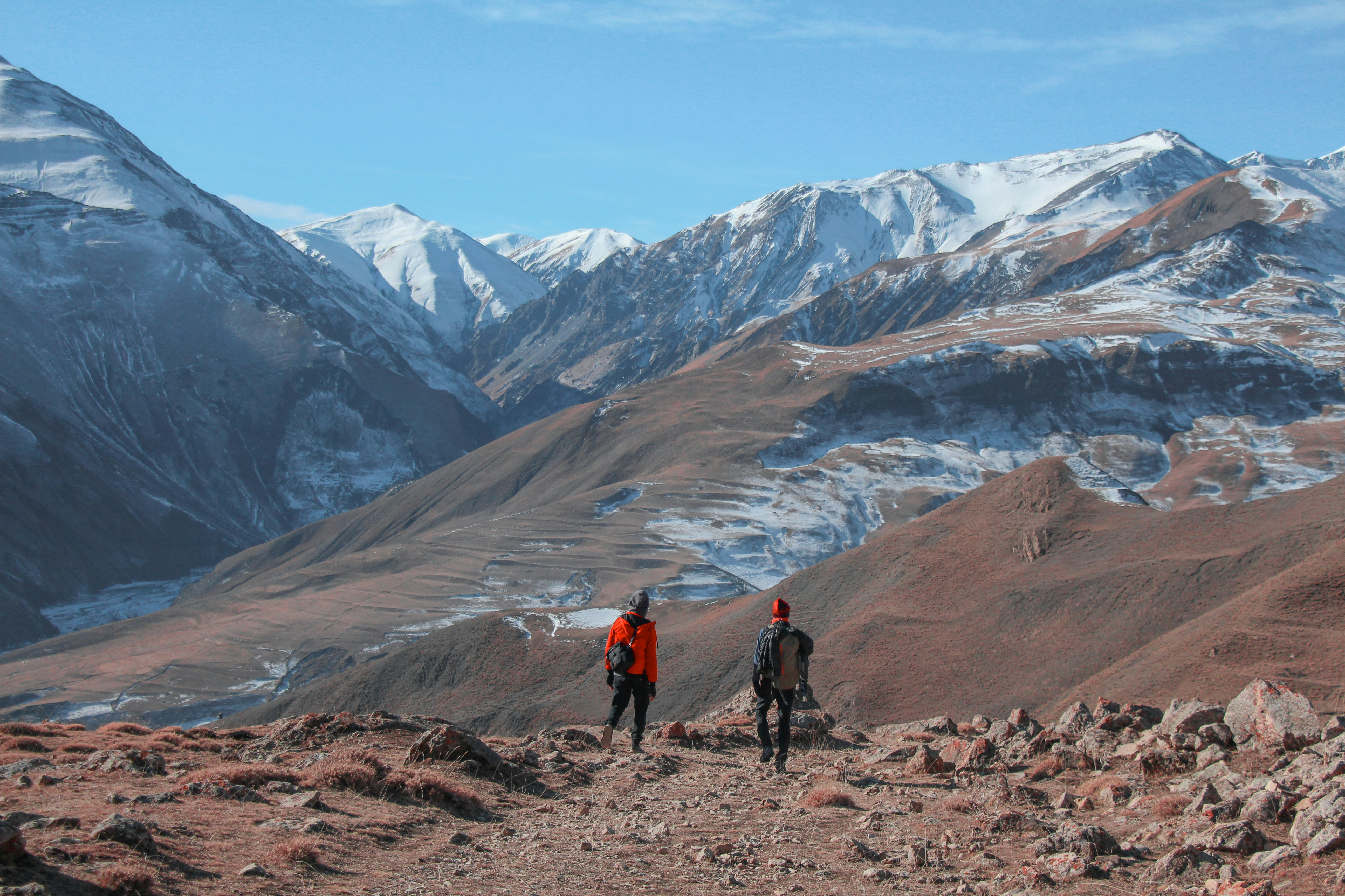 a couple of people that are standing in the dirt