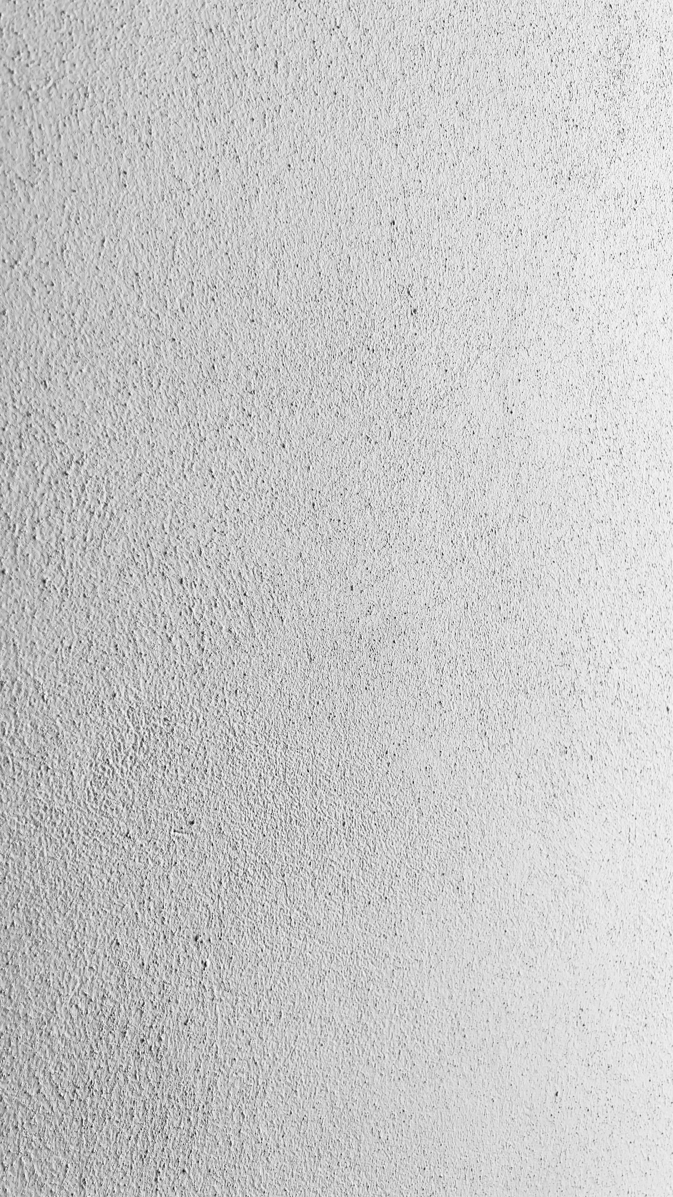 a black and white photo of a white wall