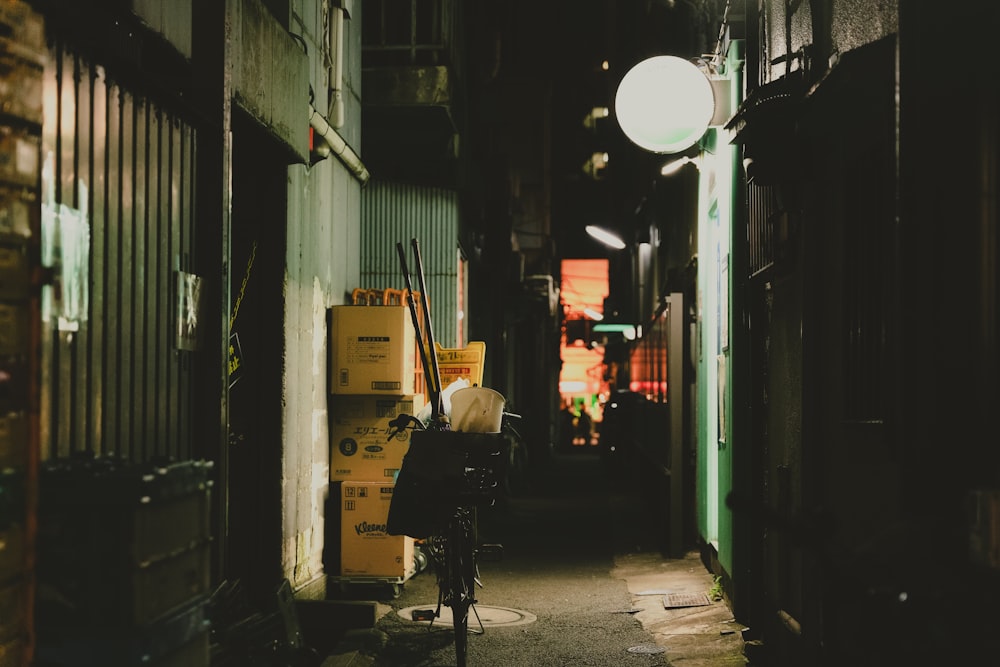 a bike parked in a narrow alley way