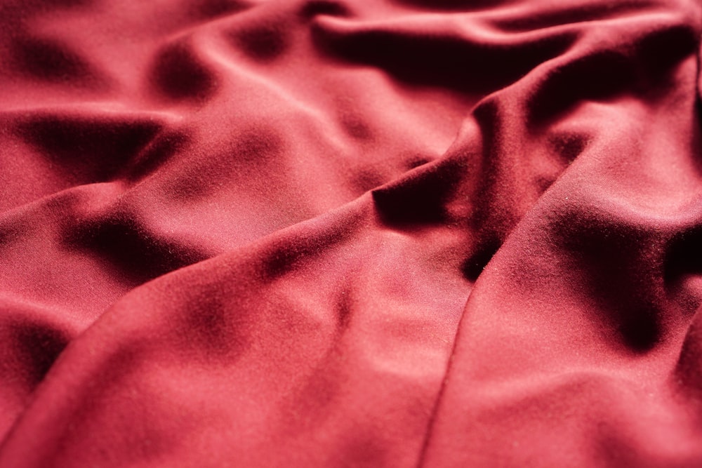 a close up view of a red sheet