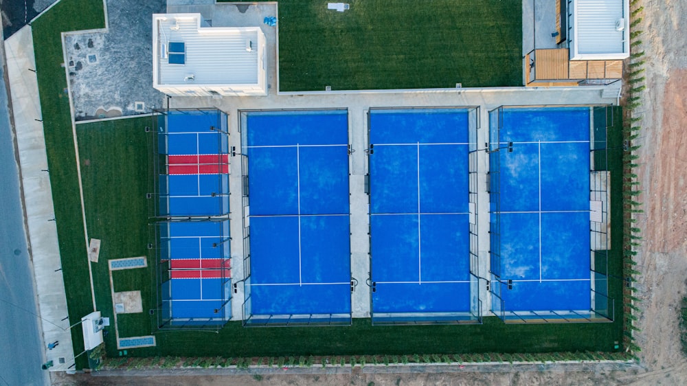 an aerial view of a blue tennis court