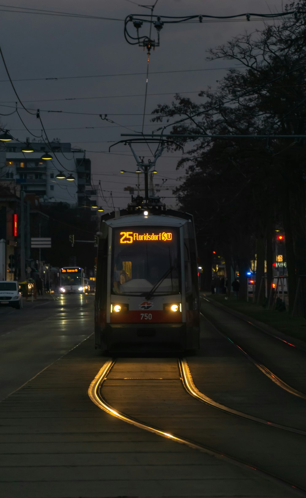 a train on a train track at night