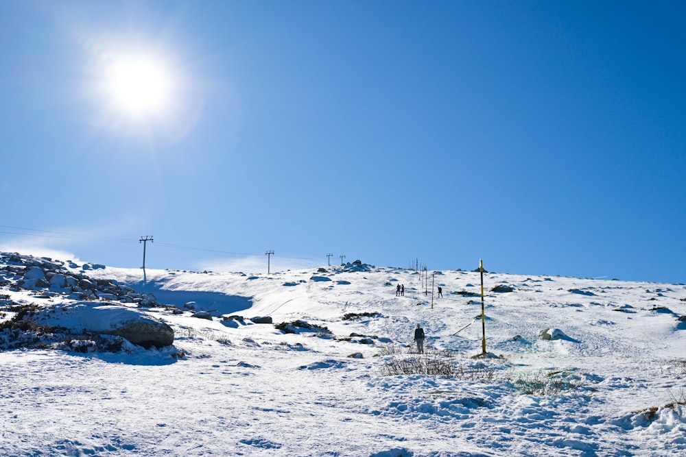 a person riding skis on a snowy surface