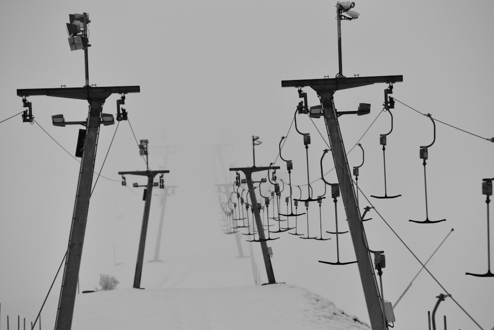 a black and white photo of a ski lift