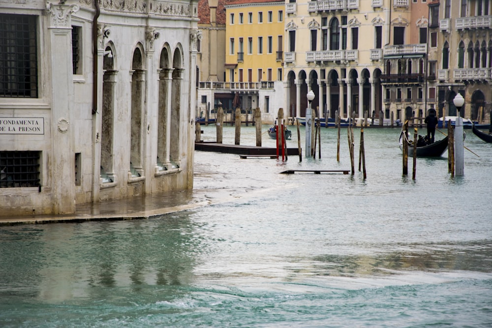 a canal with a bunch of buildings in the background