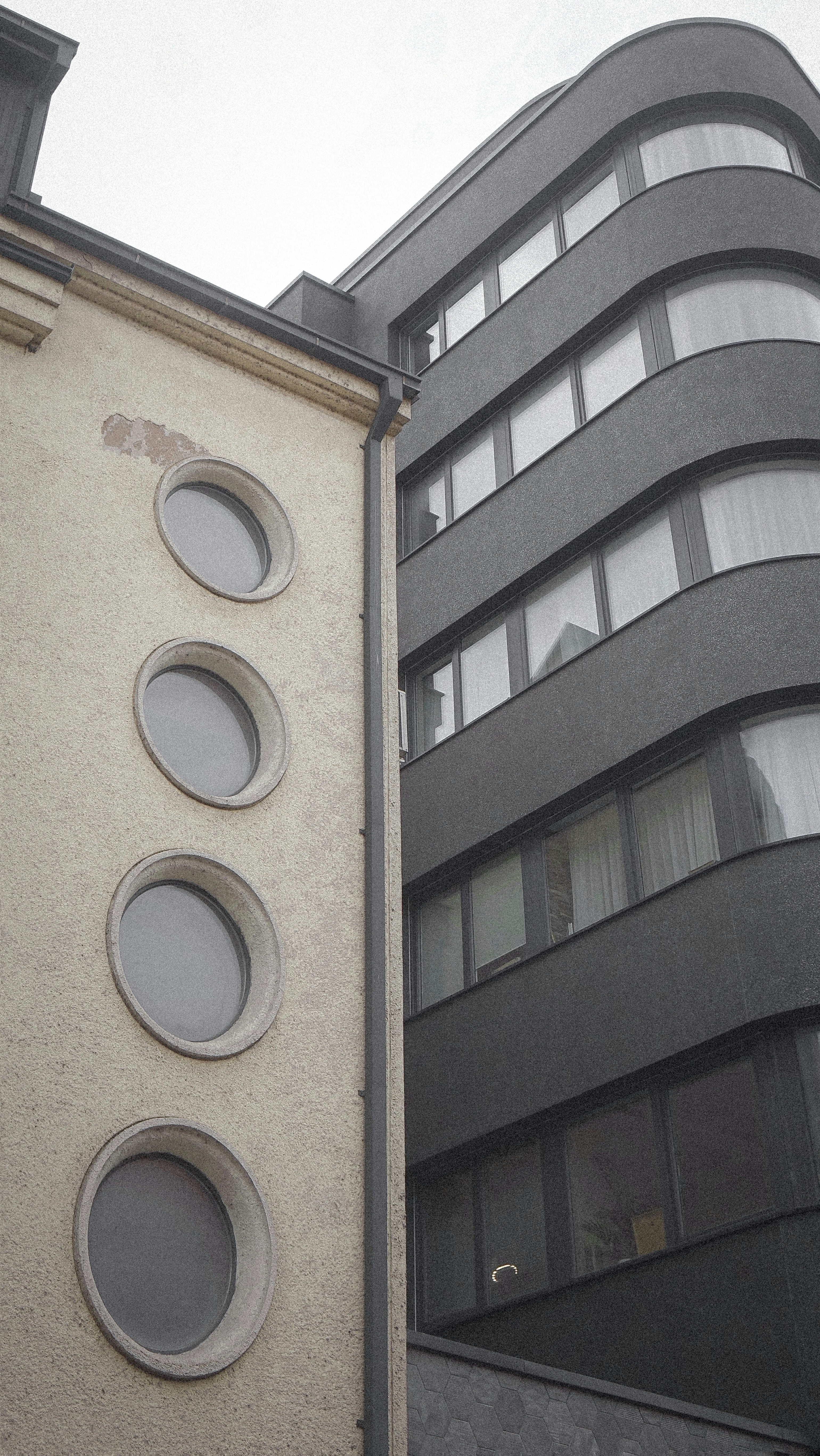 a tall building with a clock on the side of it