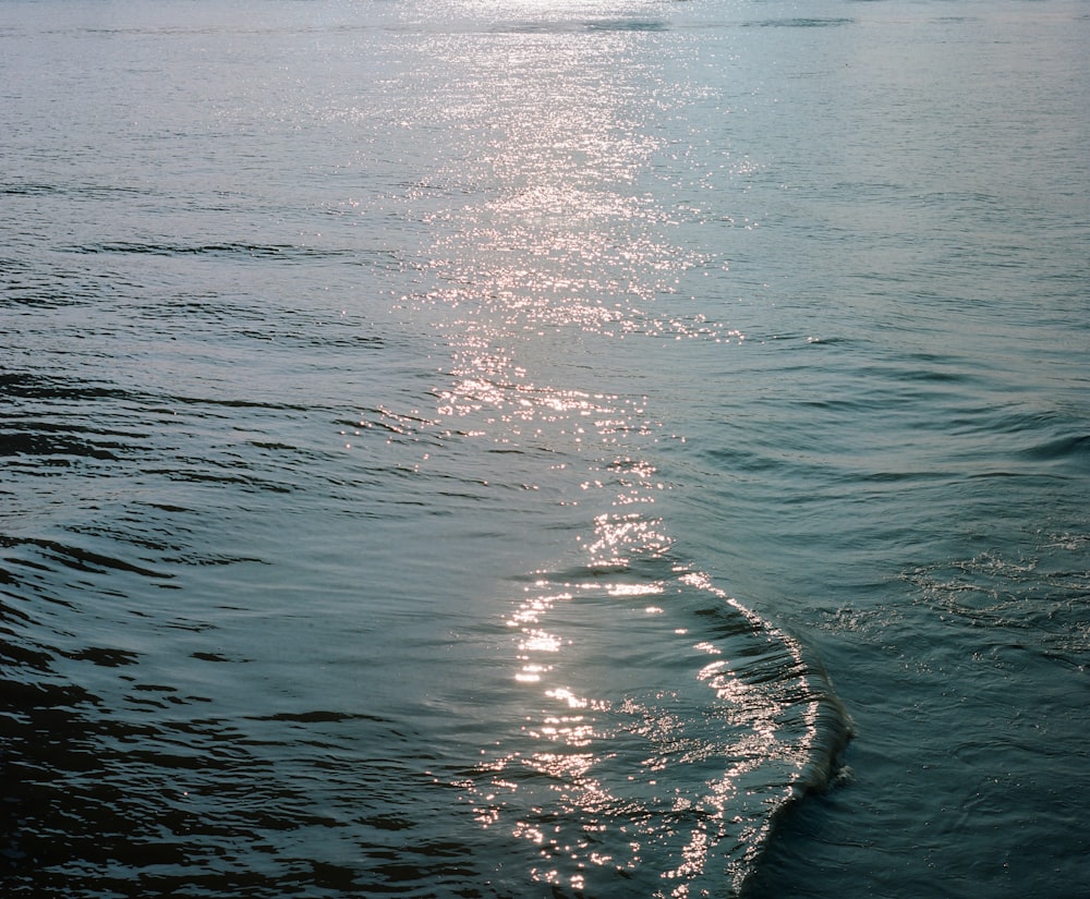 a body of water with a boat in the distance