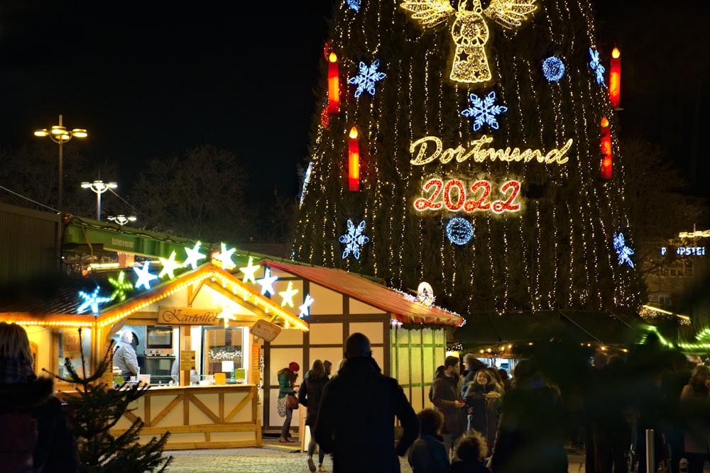 a christmas tree is lit up with lights and decorations